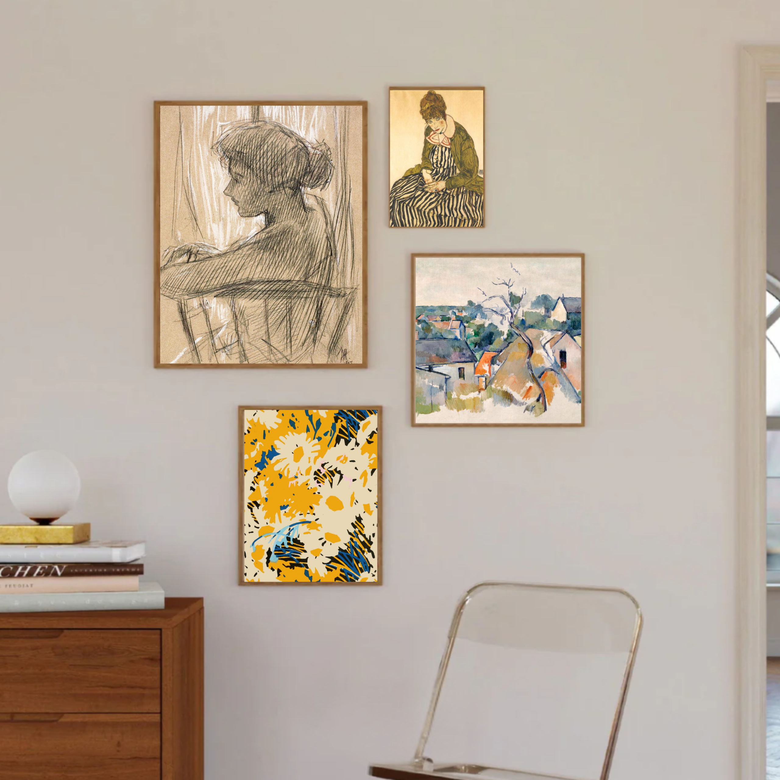 Wall gallery of framed art: a large charcoal sketch of a person, a small striped-dress portrait, and bright landscape pieces on a pale wall.
